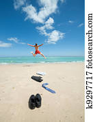 businessman jumping on the beach