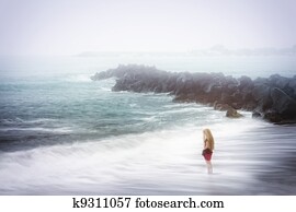 Depression and sadness concept - woman and foggy sea Depression and sadness concept - woman and foggy sea