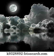 Moon in black stormy clouds