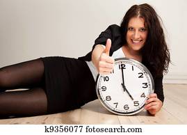 Confident Young Professional with a Clock Confident Young Professional with a Clock