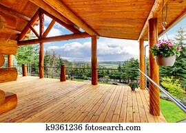 Beautiful view of the log cabin house porch.
