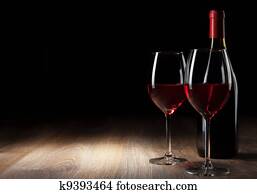 Wine glass and Bottle on a wooden table Wine glass and Bottle on a wooden table