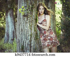 Fashion portrait of young sensual woman in garden Fashion portrait of young sensual woman in garden