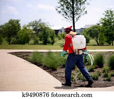 Spreading chemicals on lawn Spreading chemicals on lawn
