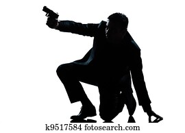 silhouette man kneeling aiming gun silhouette man kneeling aiming gun