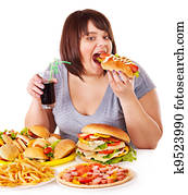Woman eating fast food. Woman eating fast food.