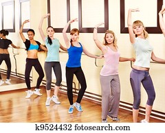 Women in aerobics class. Women in aerobics class.