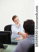 Businesswoman shaking hand to her client