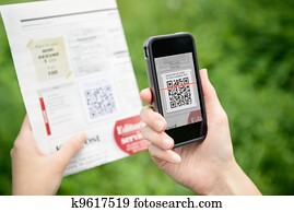Scanning advertising with QR code on mobile phone Scanning advertising with QR code on mobile phone