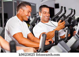 fitness man and personal trainer in gym fitness man and personal trainer in gym