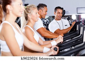 fitness people biking in gym with personal fitness people biking in gym with personal