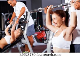 fitness woman with personal trainer in gym fitness woman with personal trainer in gym