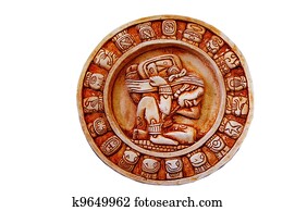 A carved Mayan calendar isolated on white