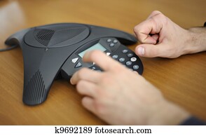 Businessman starting a conference call Businessman starting a conference call