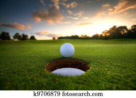 Golf Ball near hole Golf Ball near hole