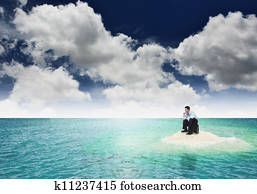 A businessman get stuck on island. A concept of businessman facing a dead end, frustration and hopeless situation in business. Can also be use to illustrate unemployment or financial crisis concept. A businessman get stuck on island. A concept of businessman facing a dead end, frustration and hopeless situation in business. Can also be use to illustrate unemployment or financial crisis concept.