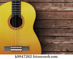 Acoustic guitar on wood background Acoustic guitar on wood background