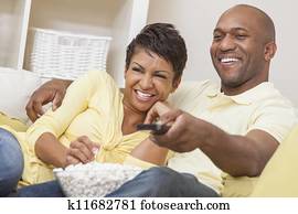 African American Couple Watching Television