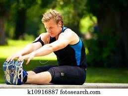 Athlete Doing Stretching Exercise Athlete Doing Stretching Exercise
