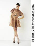 Attractive young fashion woman standing on podium