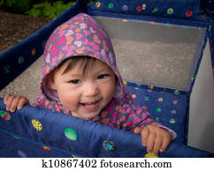 Baby Smiling in Playpen Outside