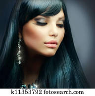 Beautiful Brunette Girl. Healthy Long Hair and Holiday Makeup 