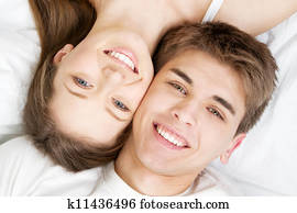 Beautiful young couple in bed