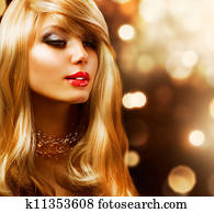 Blond Fashion Girl. Blonde Hair. Golden background 