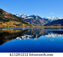 Blue mountain lake landscape view with mountain reflection Blue mountain lake landscape view with mountain reflection