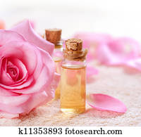 Bottles of Essential Oil for Aromatherapy. Rose Spa Bottles of Essential Oil for Aromatherapy. Rose Spa