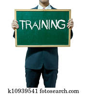 Business man holding blackboard on the background , Training