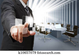 business man point virtual buttons in board room