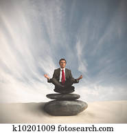 Business man relaxes on the stone