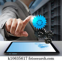 business man touch on gear as computer solution concept business man touch on gear as computer solution concept