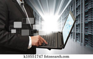 business man use notebook in server room