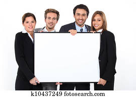Business team holding blank poster