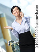 Business woman talks on mobile