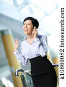 Businesswoman talks on telephone