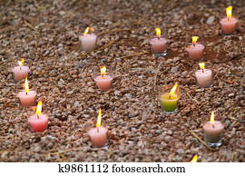 Candles in the grass at a park