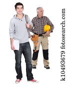 Carpenter stood with young male trainee