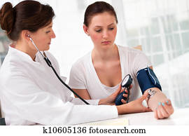 checking blood pressure
