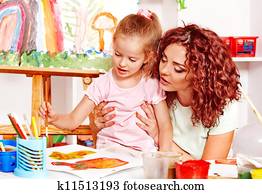 Child painting with mum. Child painting with mum.