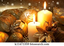 Christmas decoration with candles over dark background