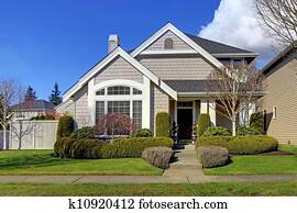 Classic new American house exterior in the spring.