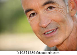 Closeup of a smiling senior man's face