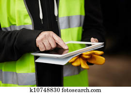 construction worker using digital tablet