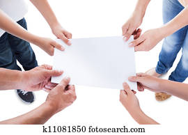 Elevated View Of Family Holding Blank Paper