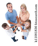 Elevated View Of Family Putting Hands Together