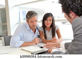 Father and girl signing loan contract