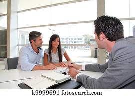 Father and girl signing loan contract